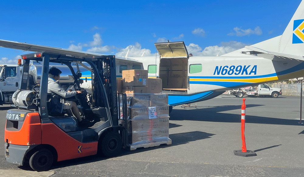 Melaleuca products being loaded on cargo plane