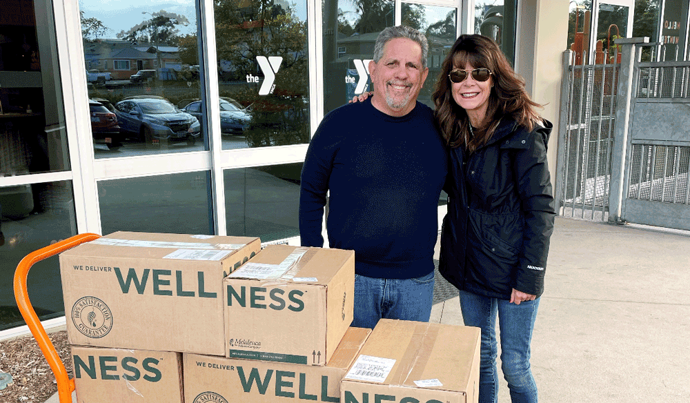 Angie Gange and Michael Braunstein making Melaleuca Donation