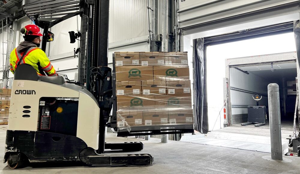 forklift driver unloads melaleuca beef donation from trailer