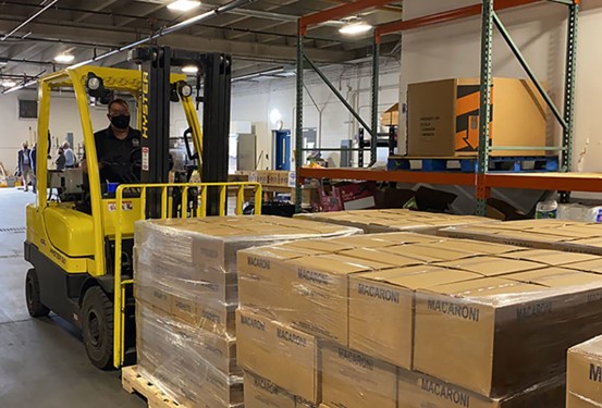 forklift driver in new food storage warehouse