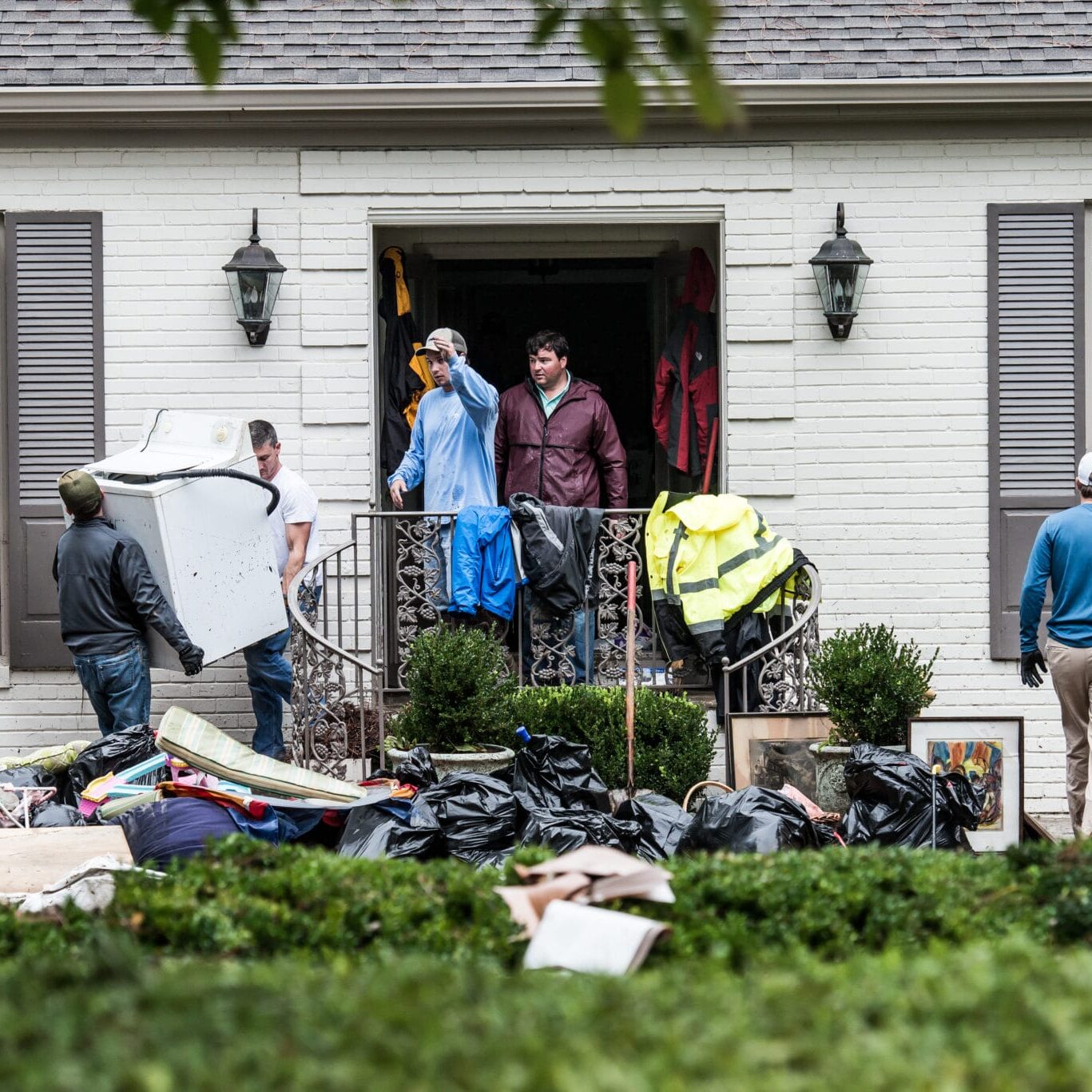 South Carolina Hit By Historic Rain And Flooding COLUMBIA, SC - OCTOBER 5: Neighbors and friends help clean up a home affected by flood waters in the Forest Acres neighborhood October 5, 2015 in Columbia, South Carolina. The state of South Carolina experienced record rainfall amounts over the weekend which stranded motorists and residents and forced hundreds of evacuations and rescues. (Photo by Sean Rayford/Getty Images)
